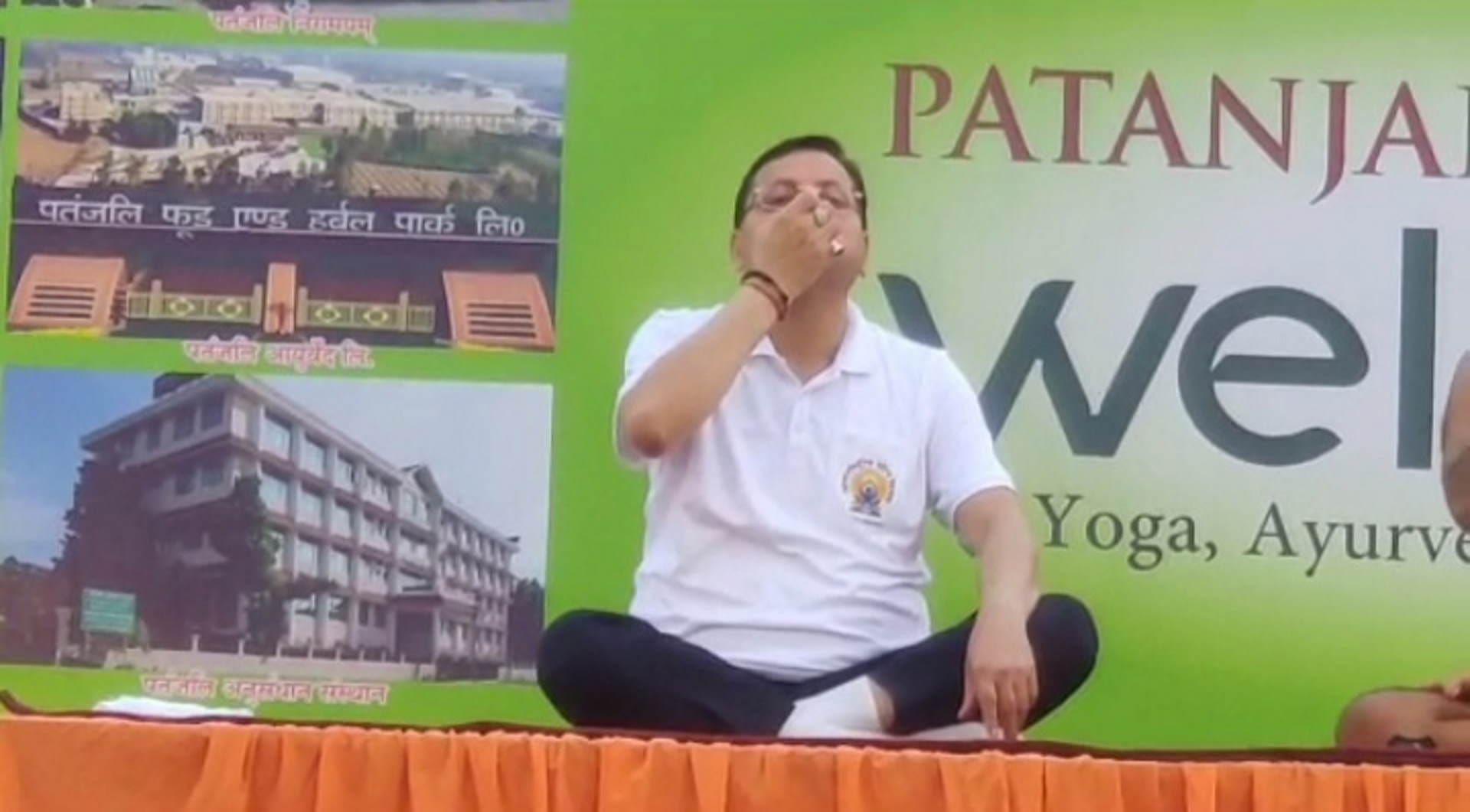 International Yoga Day 2023 Uttarakhand CM Dhami Baba Ramdev Watch Photos
