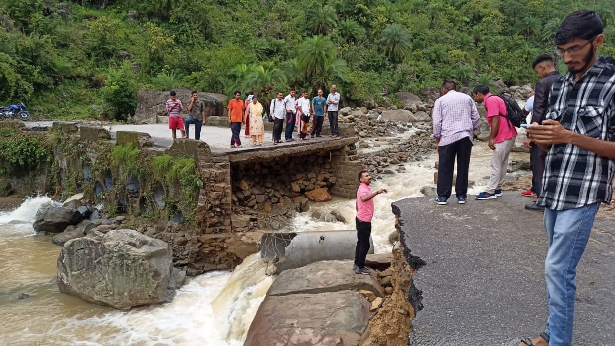 Himachal flash floods: Vehicles road washed away by flash floods in Joginder Nagar