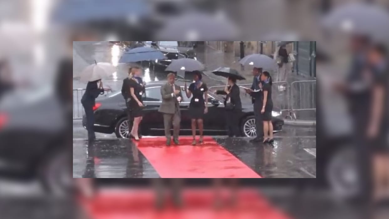 pakistan pm shehbaz sharif shameless action during france visit snatch umbrella from woman officer
