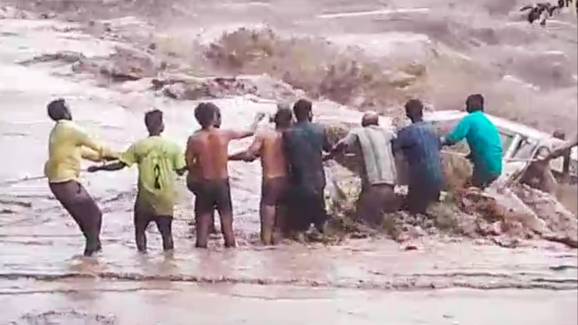 Woman washed away along with car in Ghaggar river, seven youths saved, see photos
