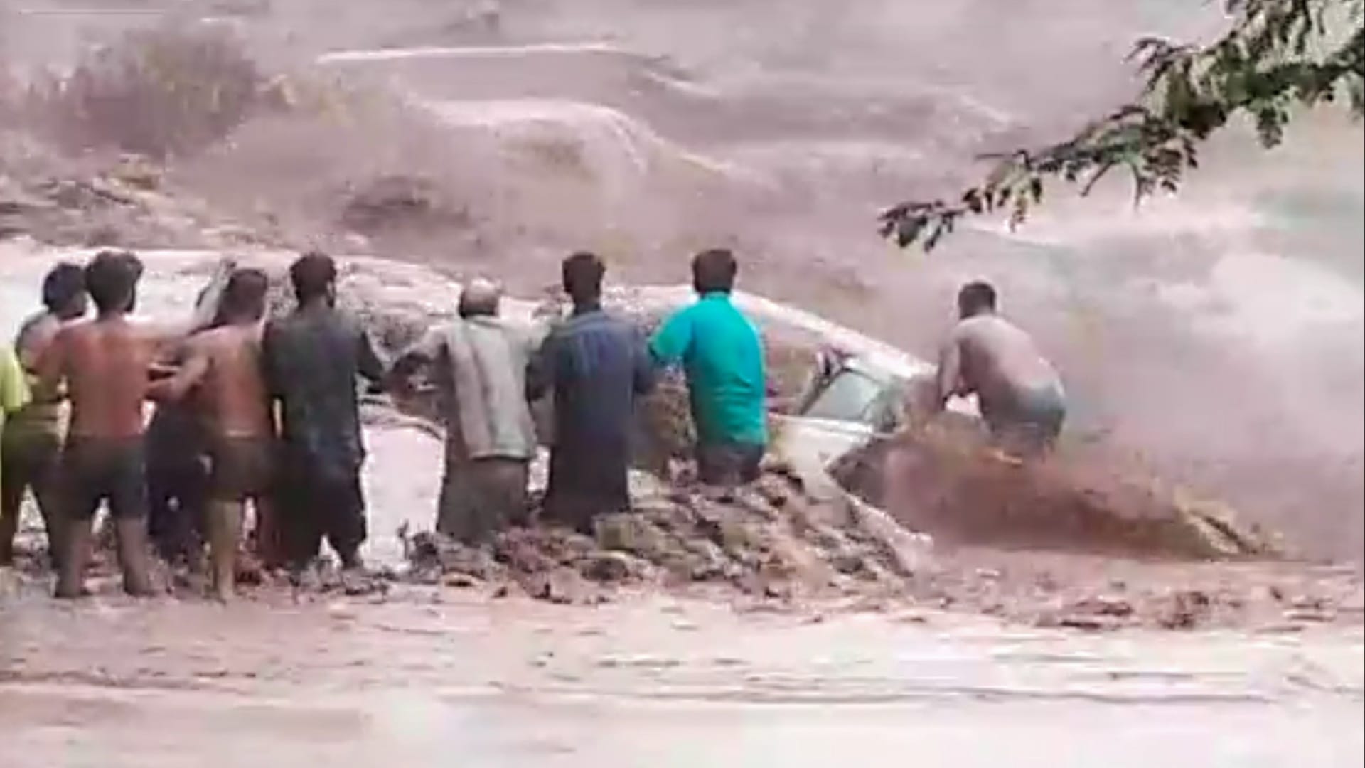 Woman washed away along with car in Ghaggar river, seven youths saved, see photos