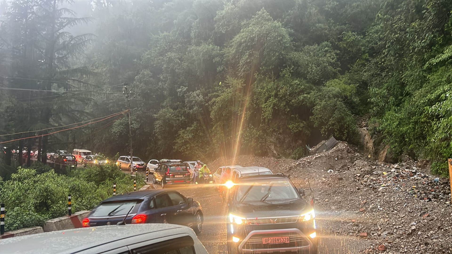 Uttarakhand Weather News rain debris on the highway vehicles stranded mussoorie Watch photos