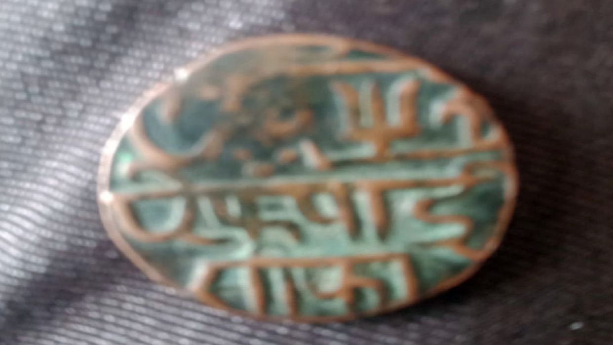 Archaeological officer arrived to verify the coin, estimated to be Mughal coin