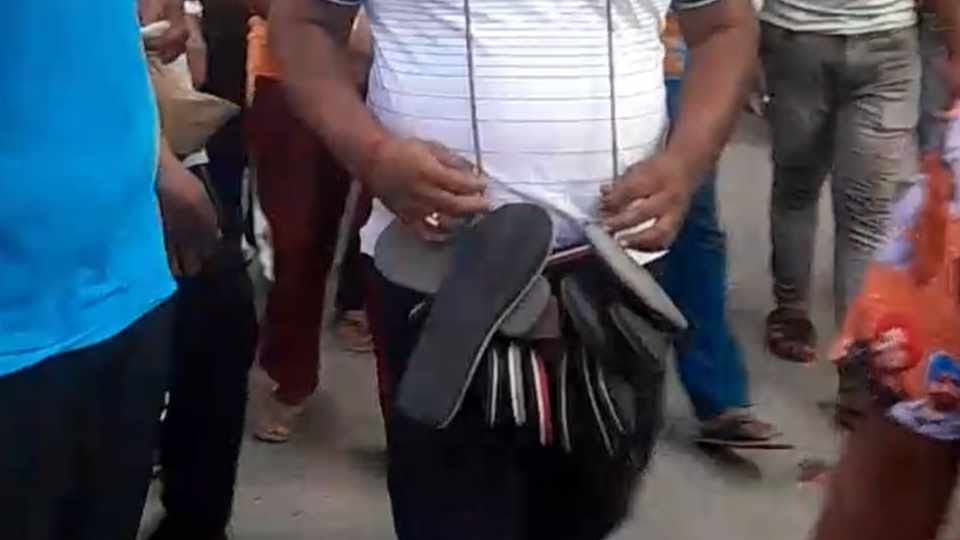 The medical store owner was paraded around the city wearing a necklace of shoes in Punjab