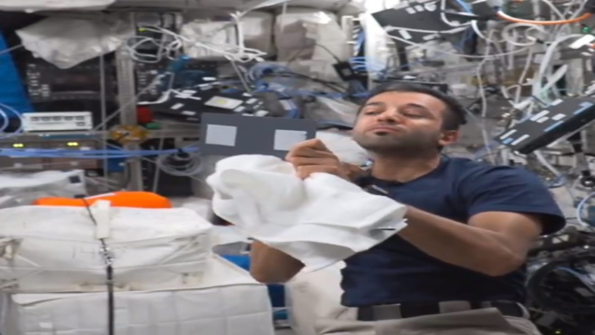 international space station uae astronaut sultan al neyadi cut his hair with vacuum trimmer nasa watch video