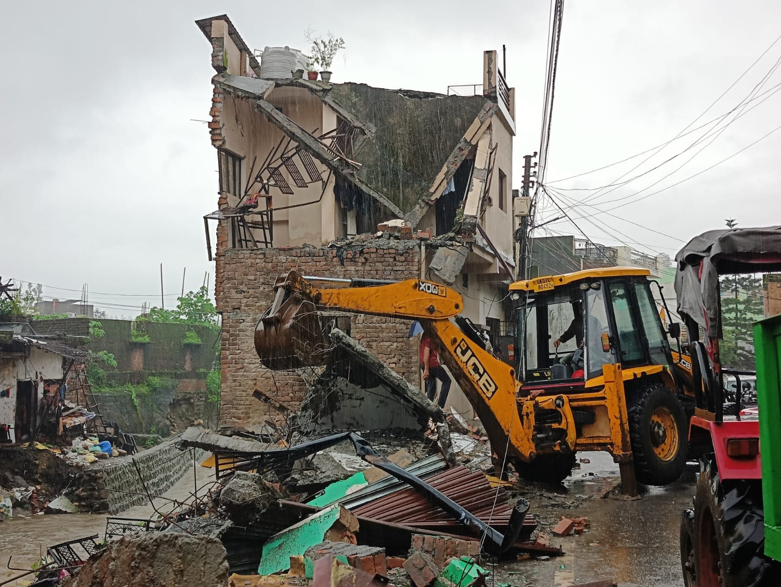 Dehradun Weather News many houses and shops Collapse after heavy rains Flood Like Condition