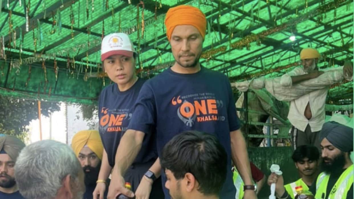 randeep hooda distributed food packets with girlfriend lin laishram to haryana flood victimes