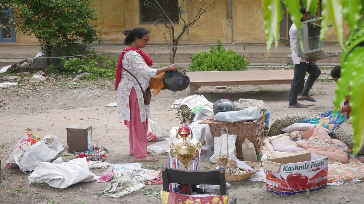 Sarva Seva SanghTears in the eyes, leaving the house after collecting household items
