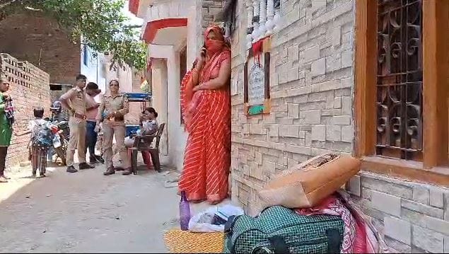 married woman sit on protest at gate of her in laws house in varanasi