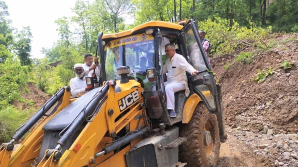 When the MLA boarded the JCB machine to open the road, also inspected