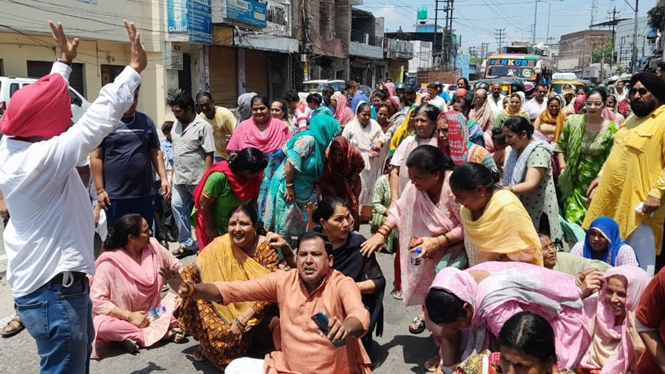 Jammu: protest outside office of power development Department against smart meters