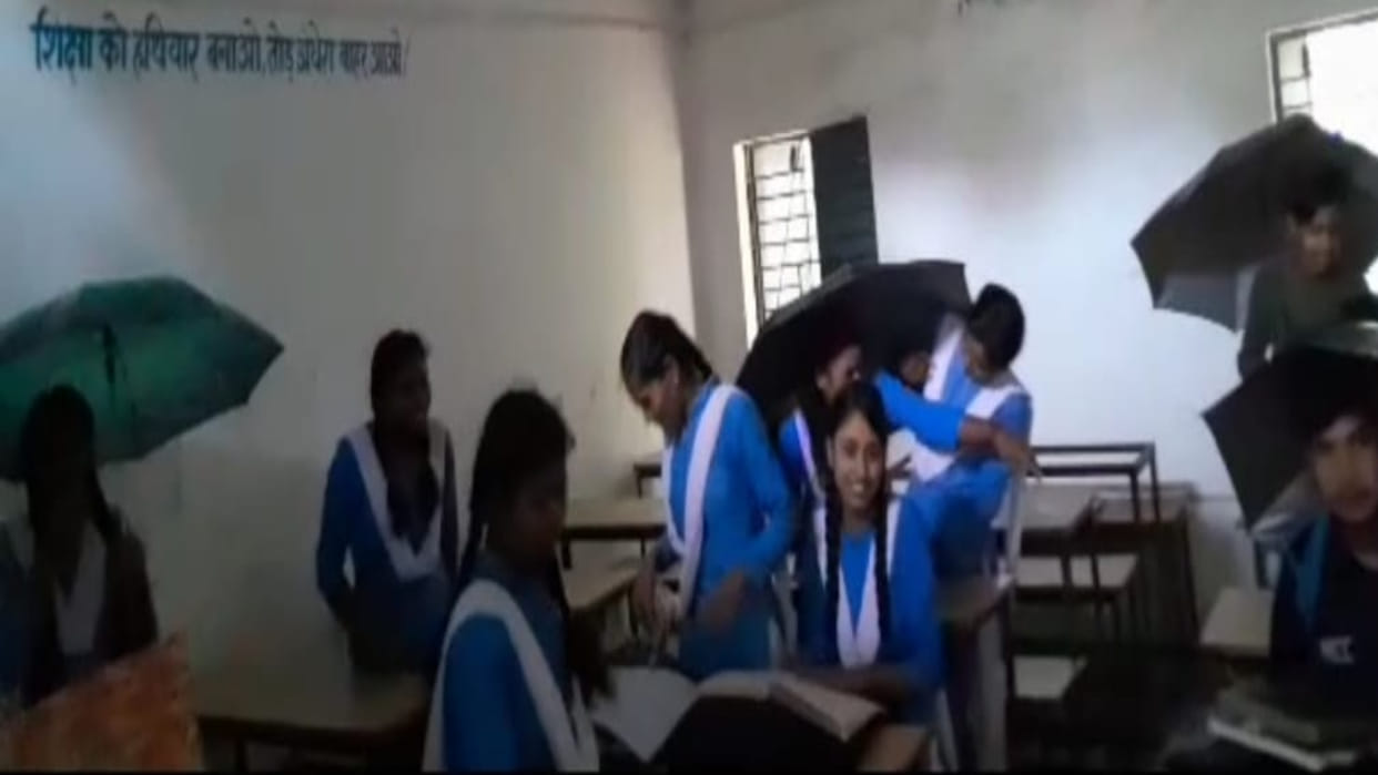 Shahdol News Children forced to study with an umbrella the roof of the class room is leaking