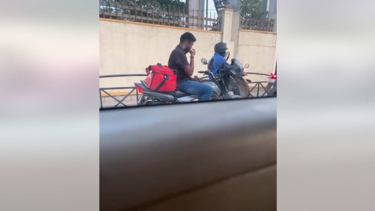 Viral Video: delivery boy eats customers food at bengaluru traffic signal video viral
