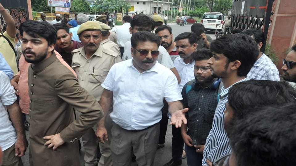 Strict action can be taken against the two students who are pushing