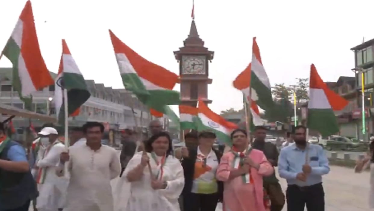 Jammu Kashmir People wave tricolour at Lal Chowk in Srinagar as they gather to celebrate 77th Independence Day