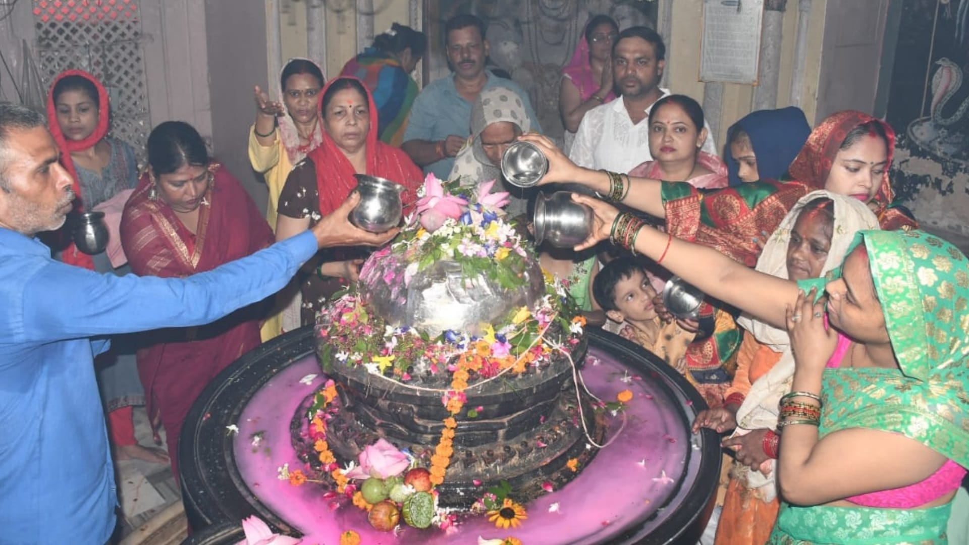 People offer prayer on Monday of Sawan in temples in Uttar Pradesh.