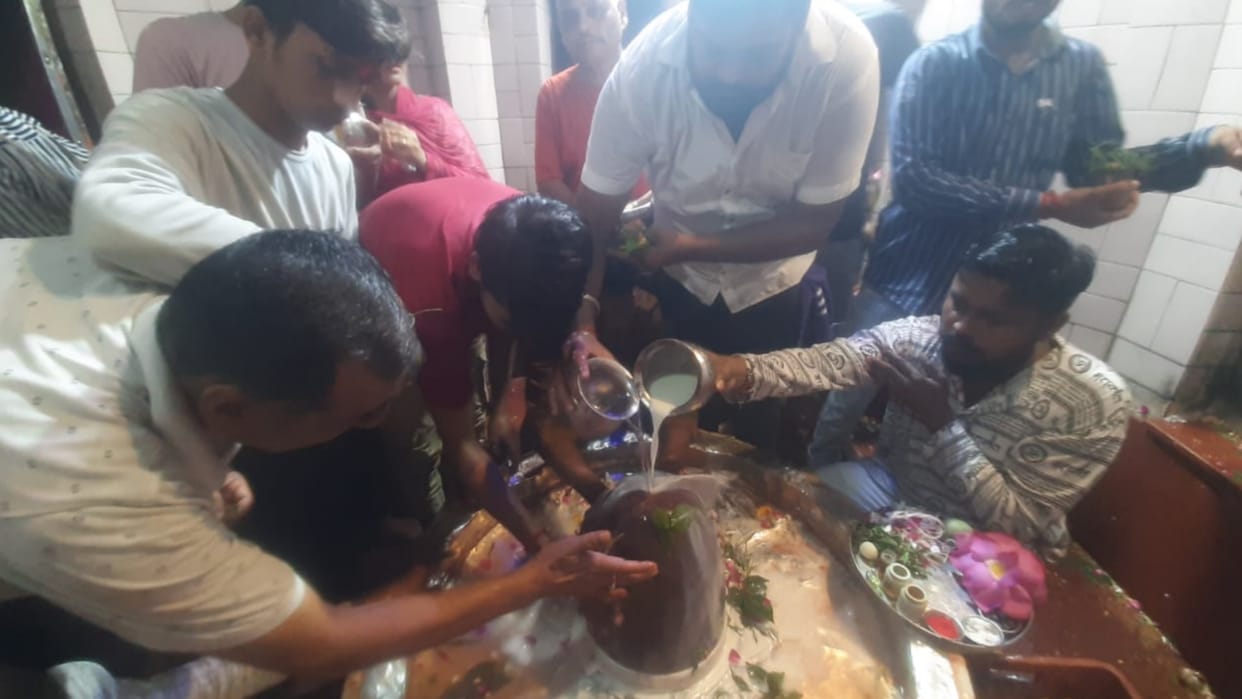 People offer prayer on Monday of Sawan in temples in Uttar Pradesh.