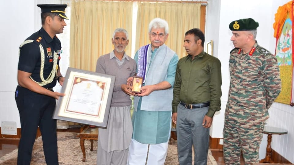 LG Manoj Sinha hands over Sarvottam Jeevan Raksha Padak to father of Martyr Mohammad Umar Dar