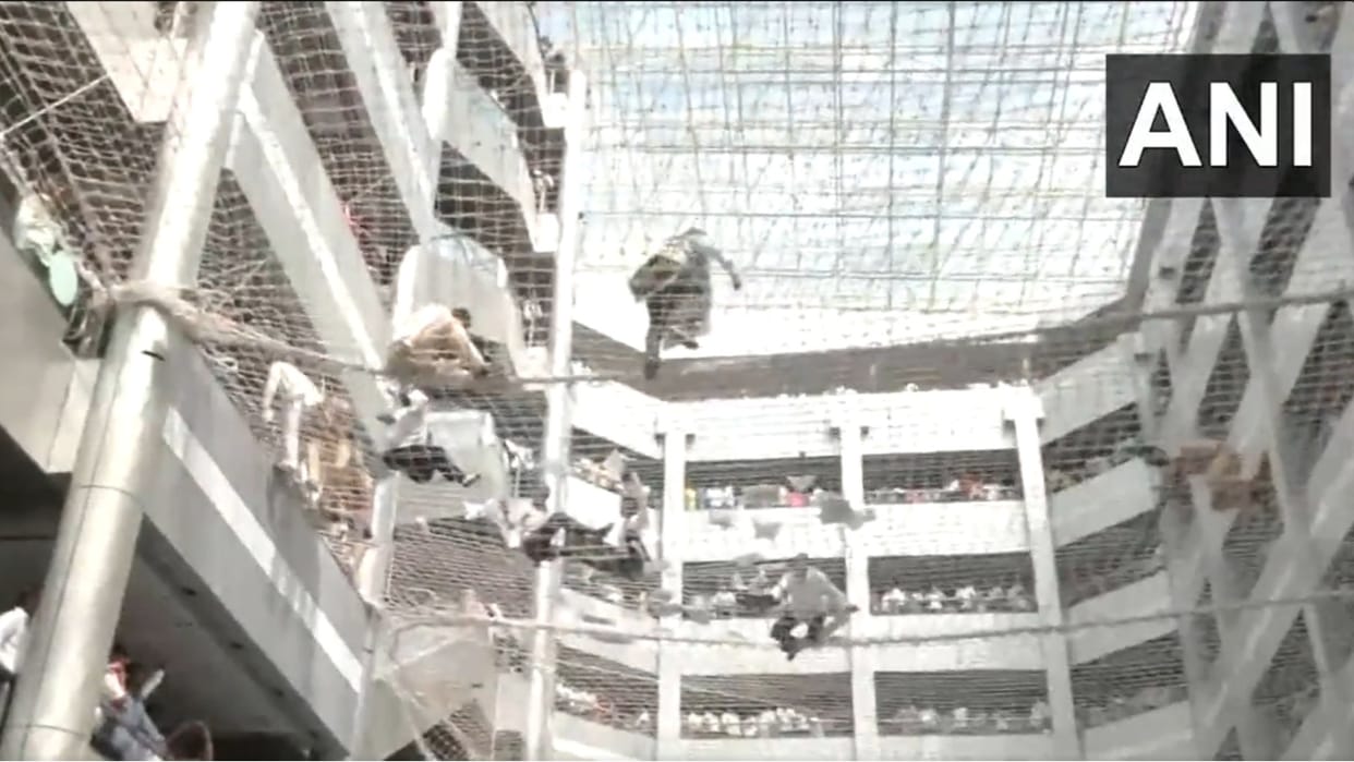 Farmers inside the Mantralaya building protesting against the Maharashtra govt jump on protective net