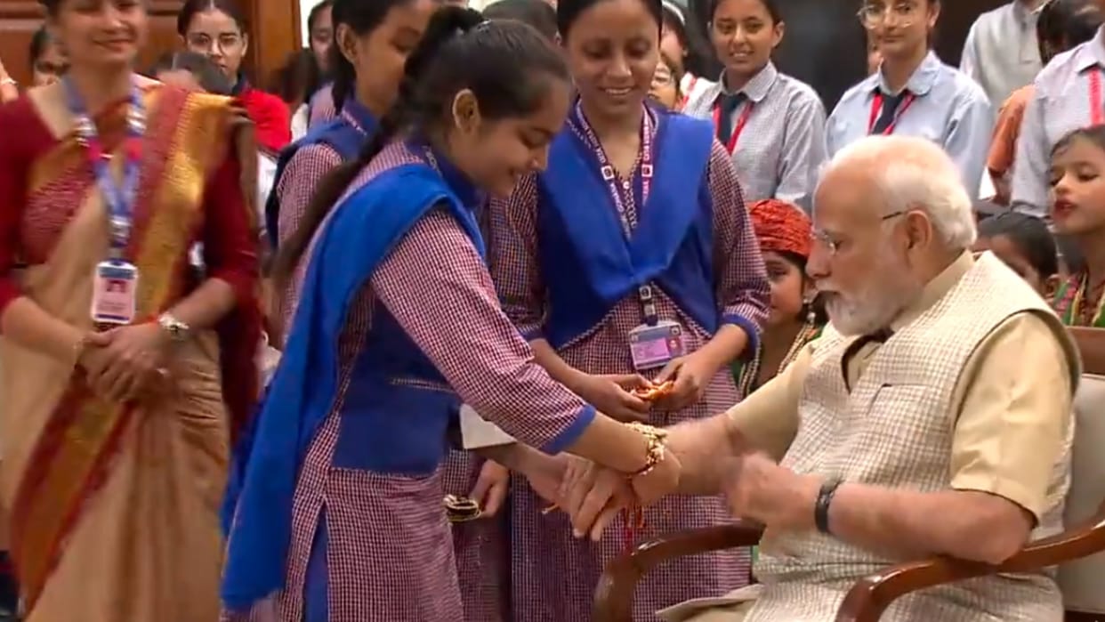 school girls tie rakhi to pm modi in delhi celebrate raksha bandhan festival video