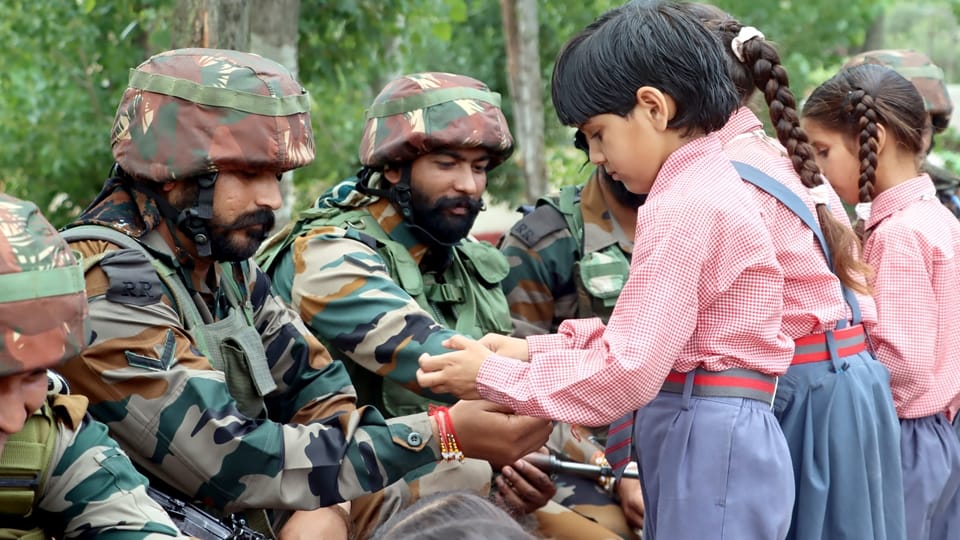 jammu kashmir: little girls tying rakhi to jawans guarding borders of nation and distributed sweets