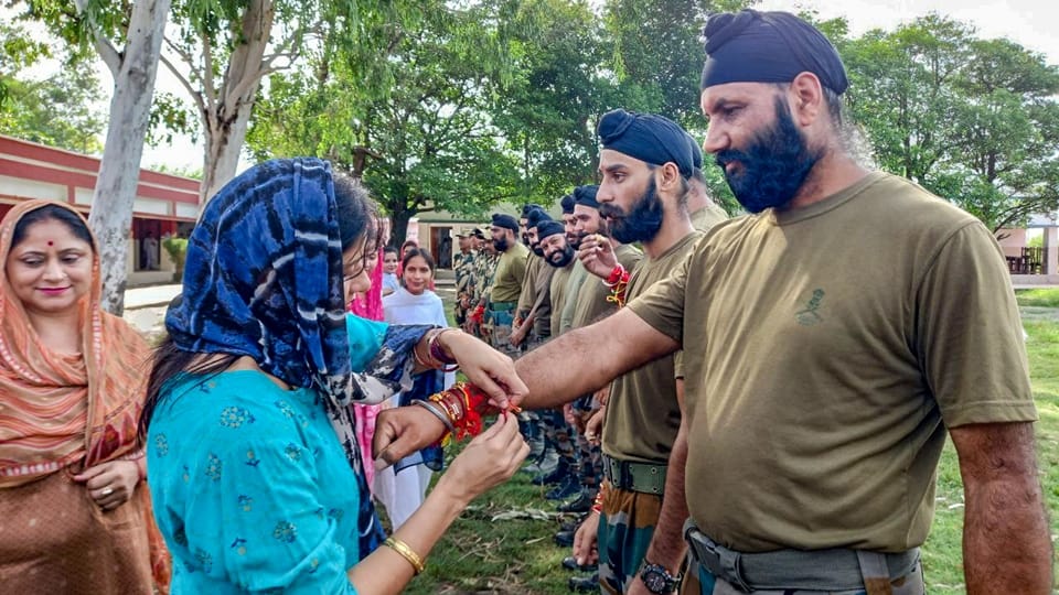 jammu kashmir: little girls tying rakhi to jawans guarding borders of nation and distributed sweets