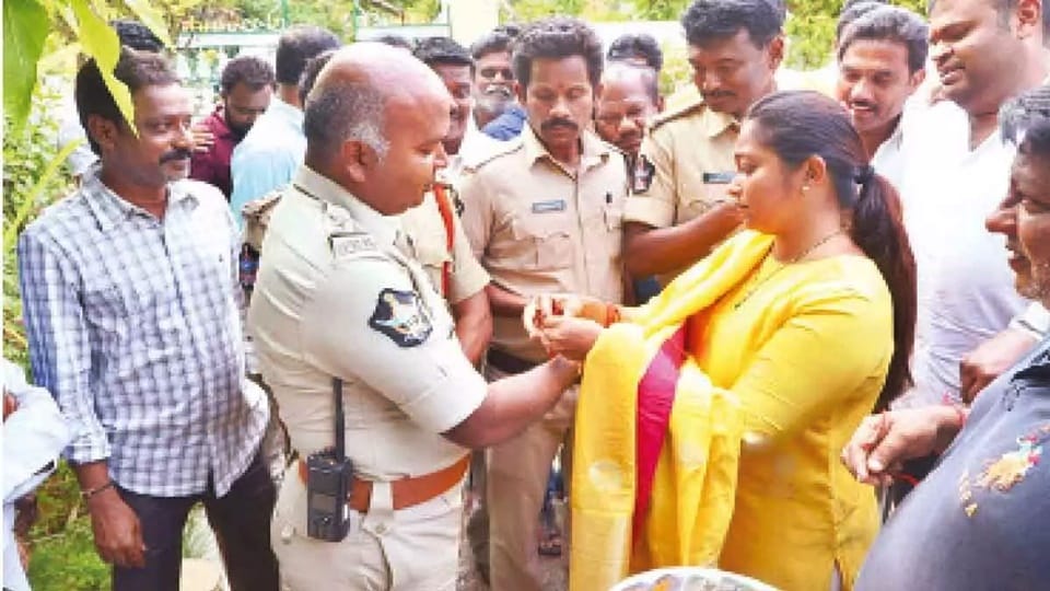 Wife of TDP leader ties rakhi to police officers who came to place her husband under house arrest