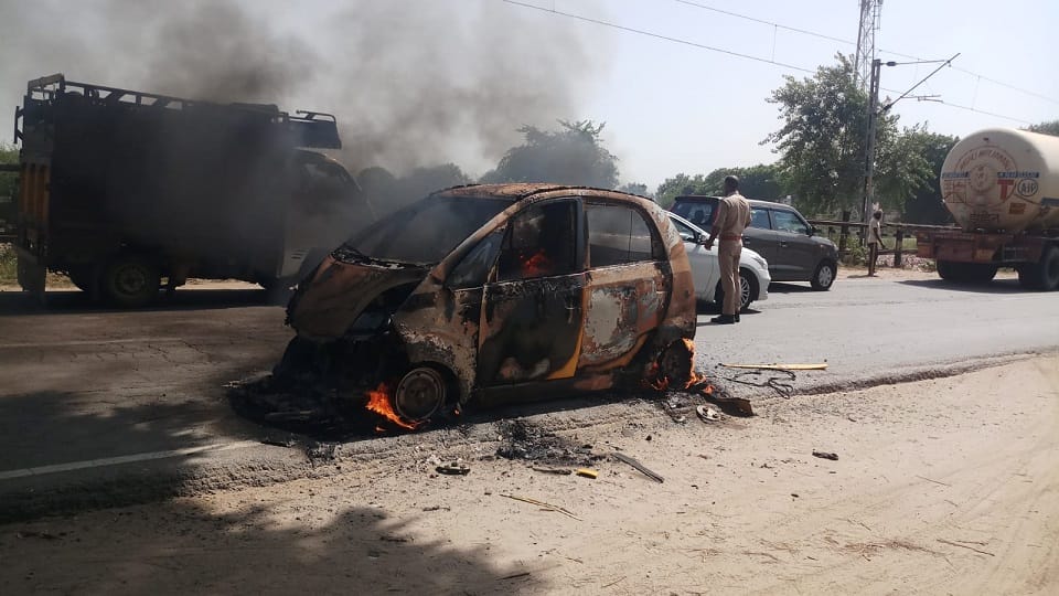 Moving Nano car caught fire four youths saved their lives by jumping