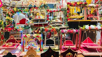 People queue up to buy clothes and idols of gods at shops in Mankameshwar street in Agra