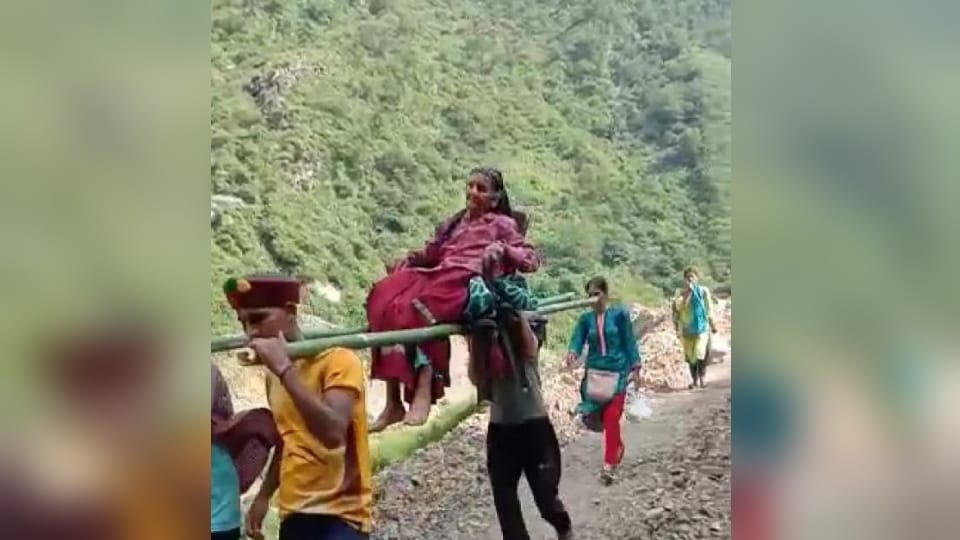 Dehradun Kalsi News Paralyzed woman was carried on villagers shoulder for five kilometers to reach hospital