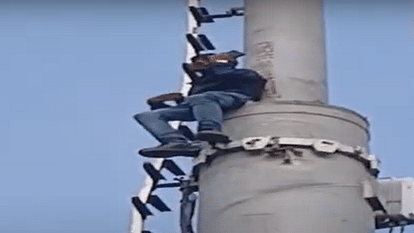 Young man climbed on mobile tower threatening to jump