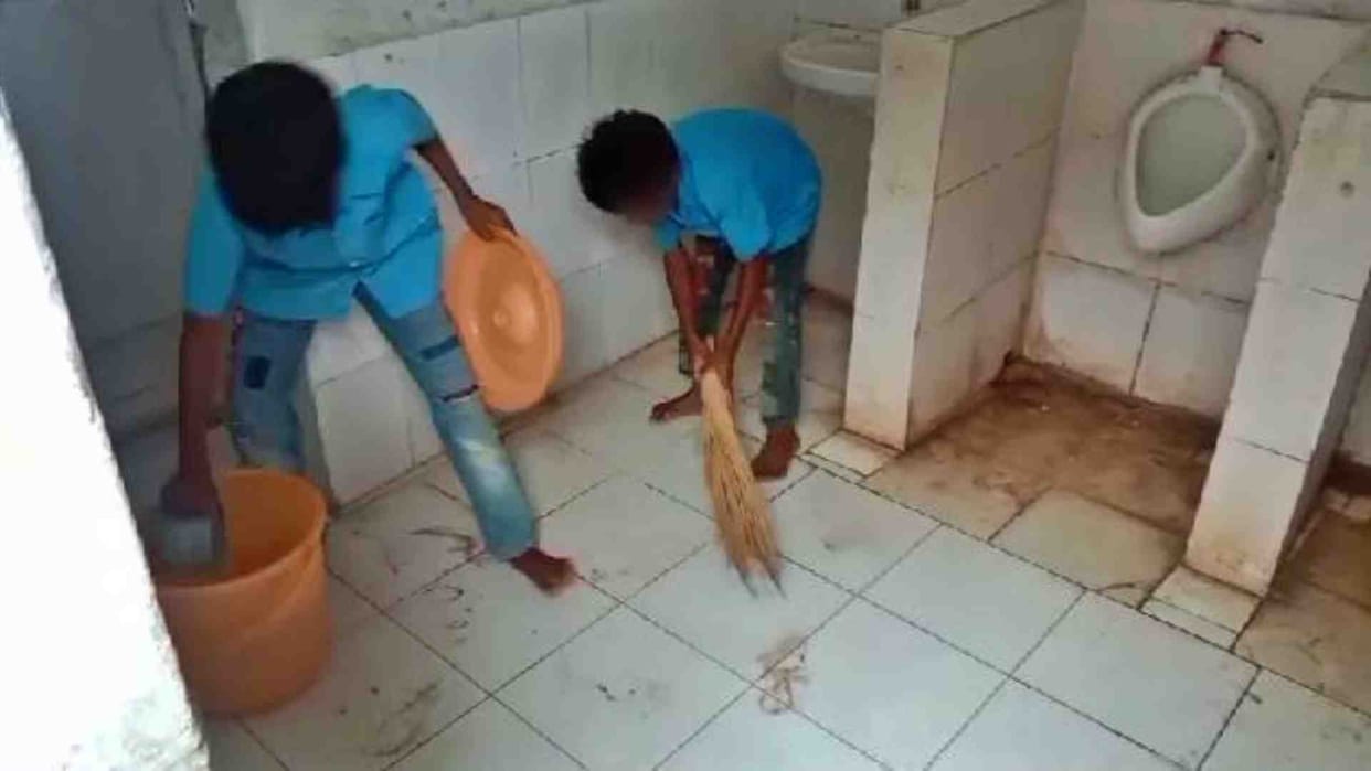 Children cleaning dirty toilets of primary school of Shahdol Dongria Tola