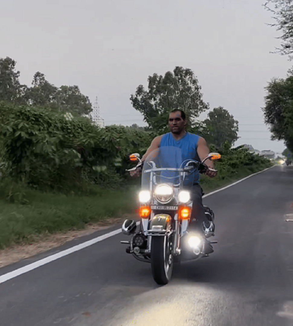 WWE wrestler The Great Khali rides this powerful bike make it look like a kid's bike