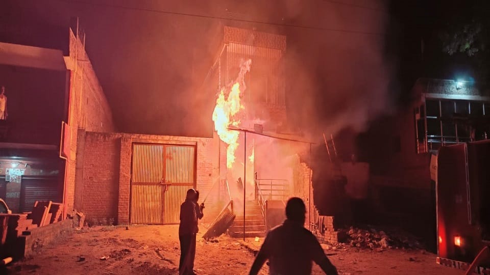 Fire broke out in a two-storey building Flames rising from the shop surrounded  house businessman family got