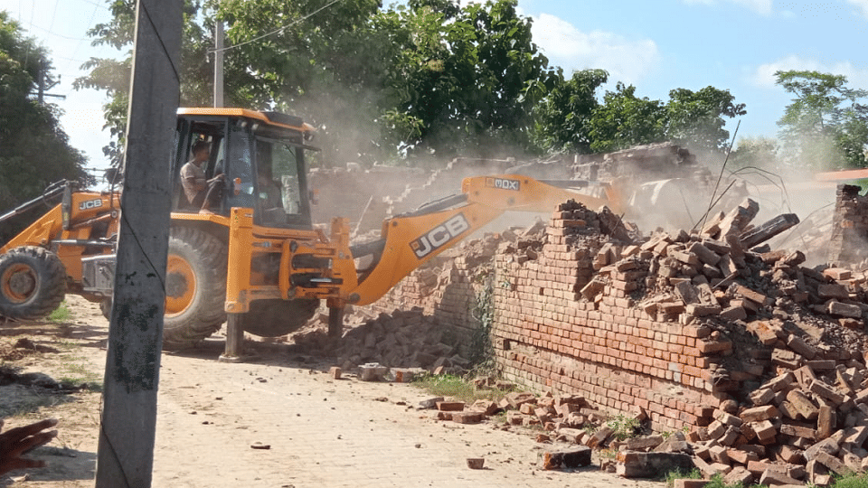 Administration bulldozer runs on murderer house in Siddharthnagar