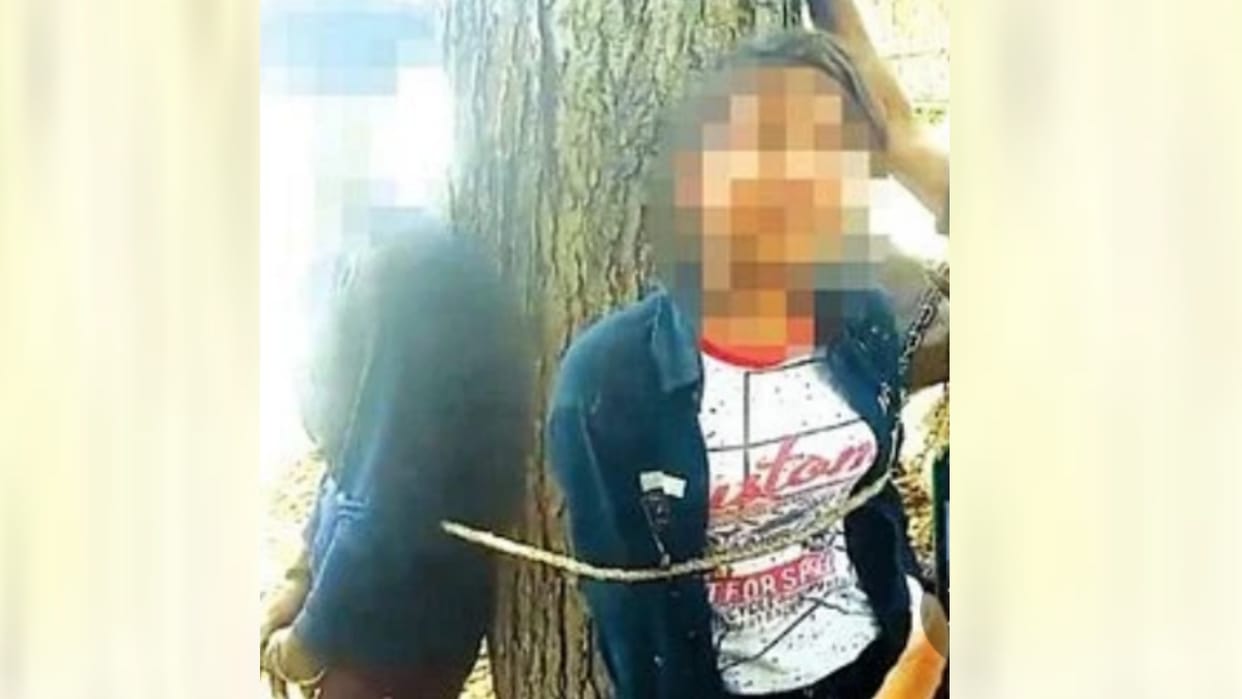 Boyfriend and girlfriend tied to a tree and slapped, video goes viral