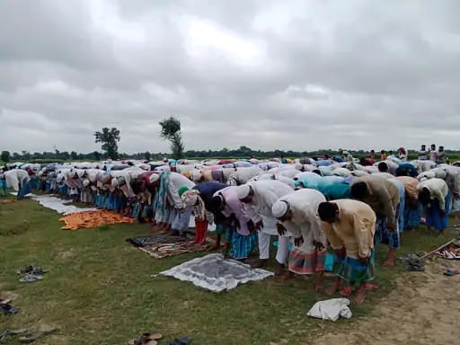 worshipers turn their palms towards the ground, special prayer Namaz outside the mosque in bihar