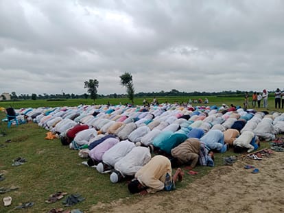 worshipers turn their palms towards the ground, special prayer Namaz outside the mosque in bihar