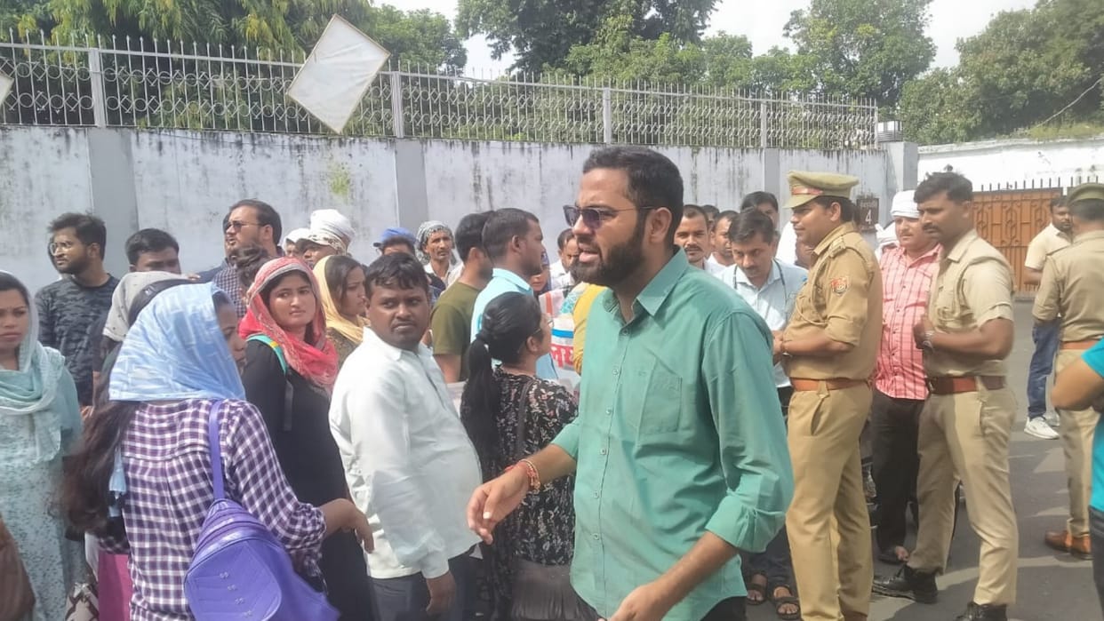 Applicants protest near basic education minister home in Lucknow.