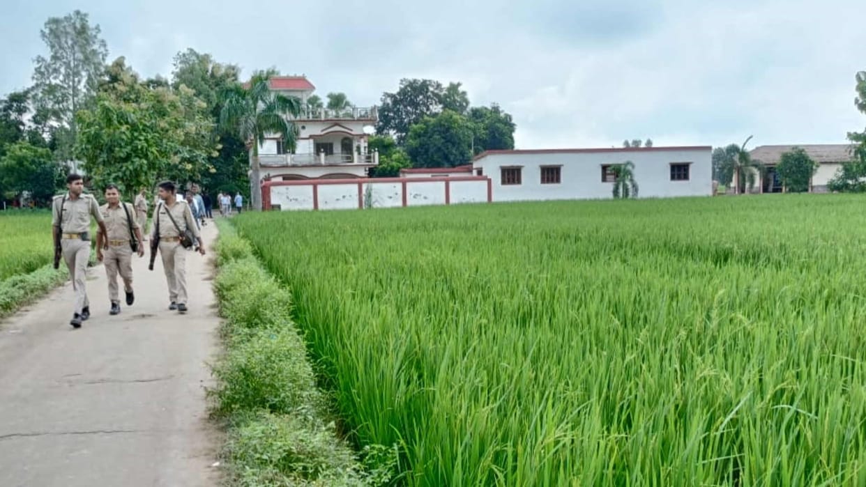 Deoria murder case Bulldozer standing at a short distance from house of accused