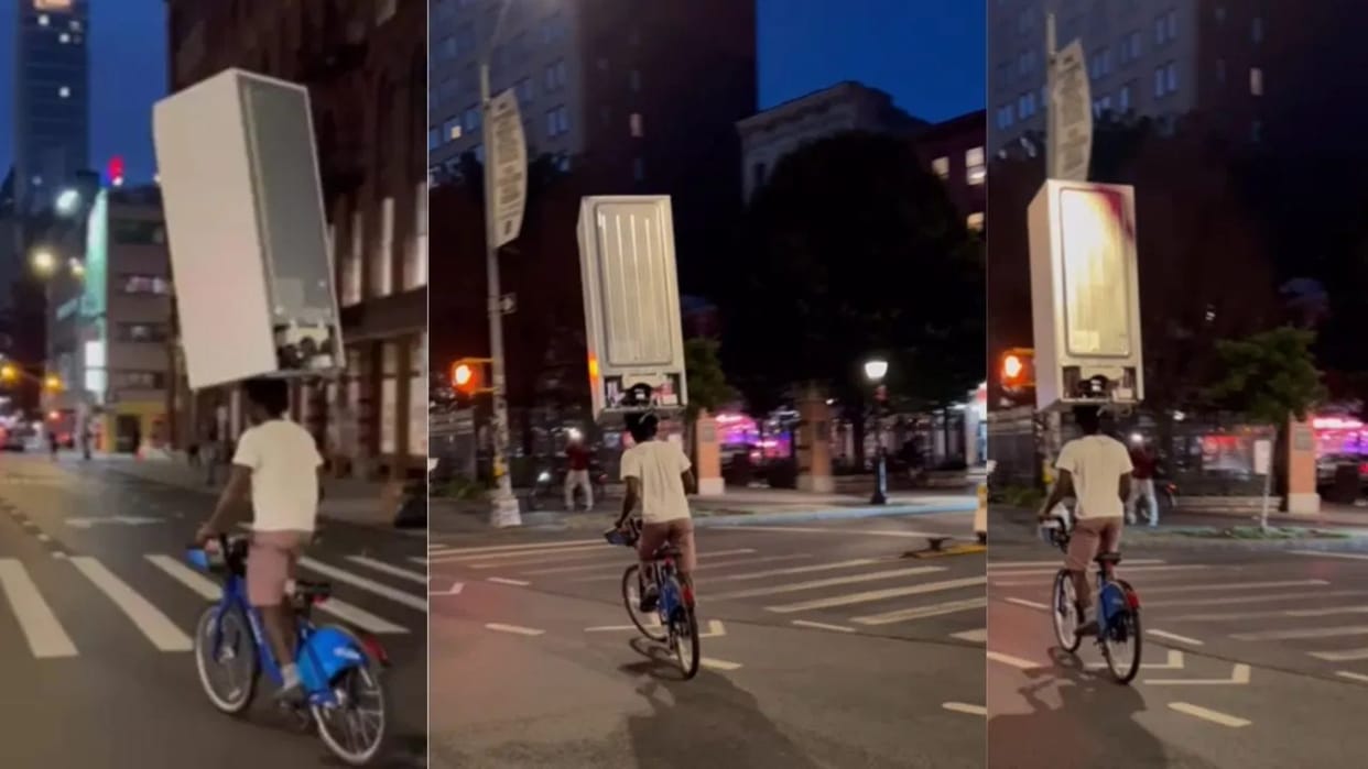 Viral Video Shows Man Carrying Fridge On Head While Cycling; Internet In Disbelief