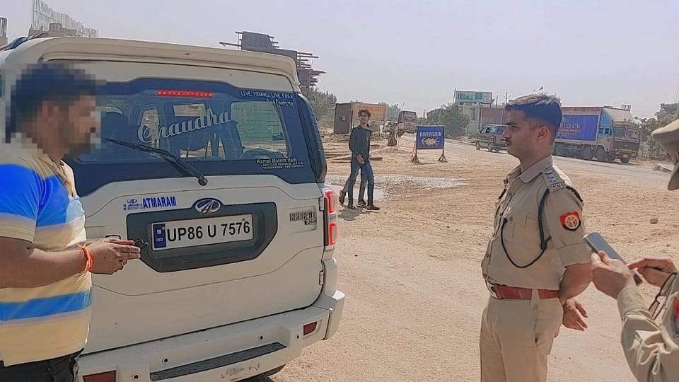 caste indicative words, black film and red-blue lights on the vehicle