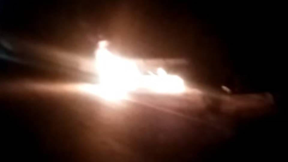 container parked caught fire after high tension line wire fell on it in Agra