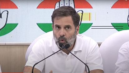 Rahul Gandhi shows a media report on 'Adani and the mysterious coal price rises' at a press conference