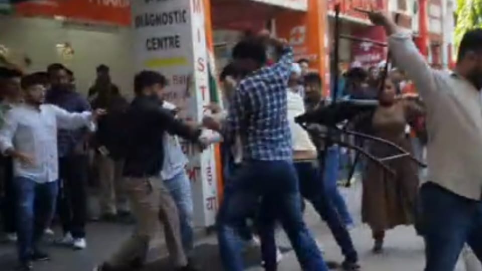 Chairs thrown fiercely between two lab workers, bricks pelted
