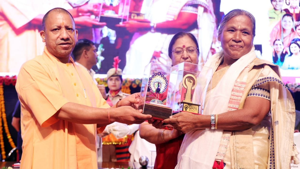 CM Yogi Adityanath honours women under mission shakti yojna in Lucknow.
