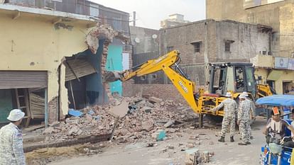 Shops along with residential buildings demolished it built by encroachment on Station Road in Firozabad