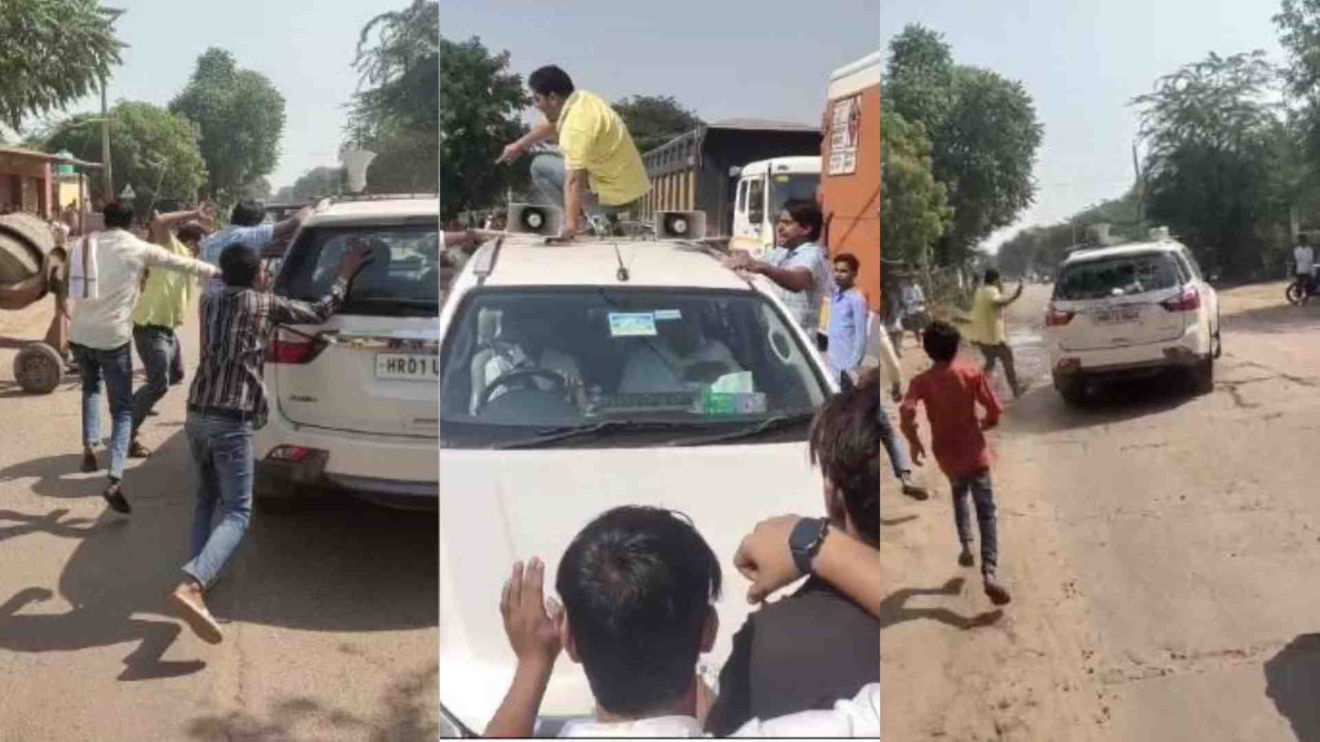 विधायक पति की गाड़ी पर हमला करते स्थानीय लोग।