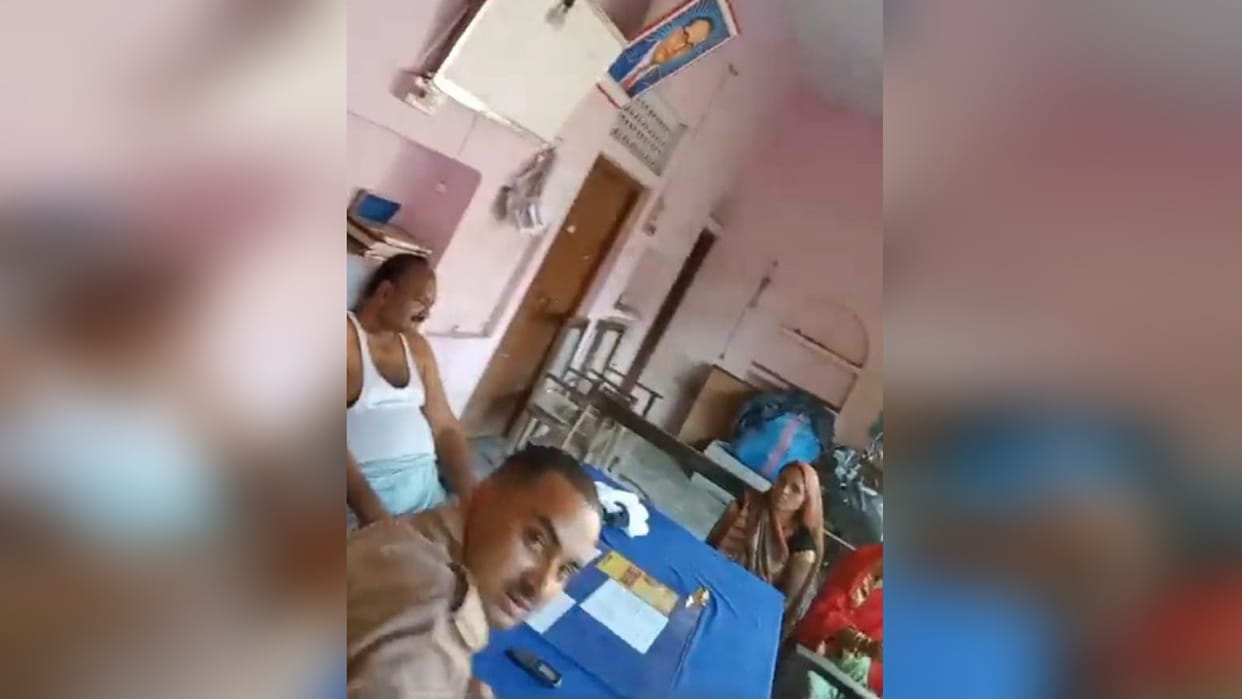The outpost incharge, who listened to the complaint wearing lungi and vest, is present