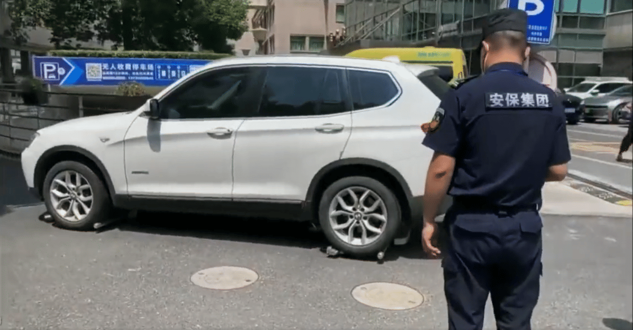 china police using automated valet parking robots for to remove illegally parked cars